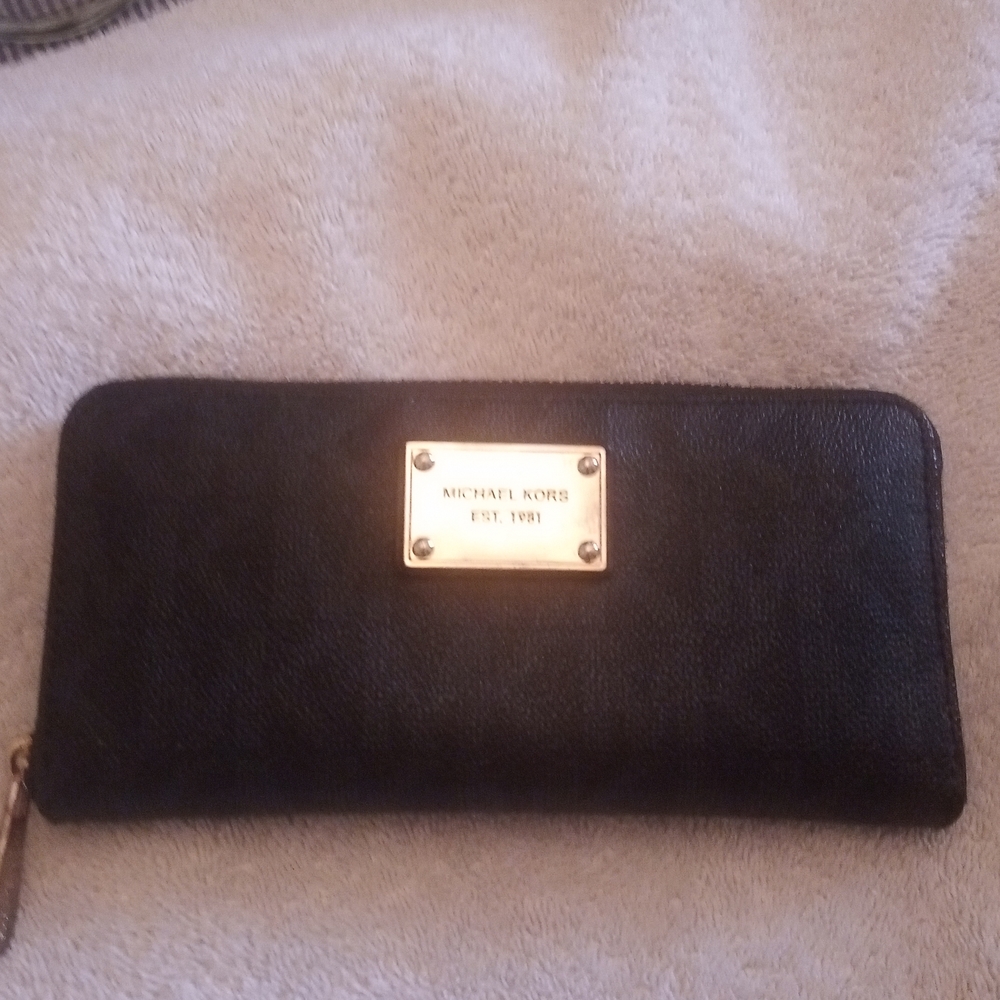 Black Michael Kors wallet, 8 X 4", lots of room for bills and cards and coins.
